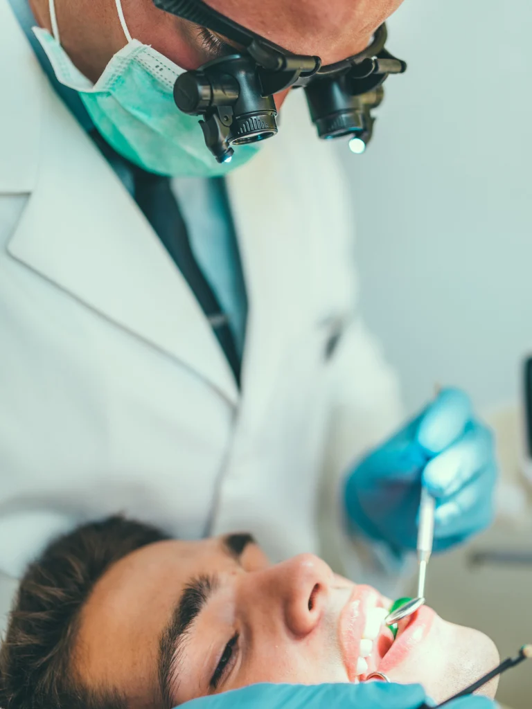 Dentist Doing Root Canal Treatment On Patient