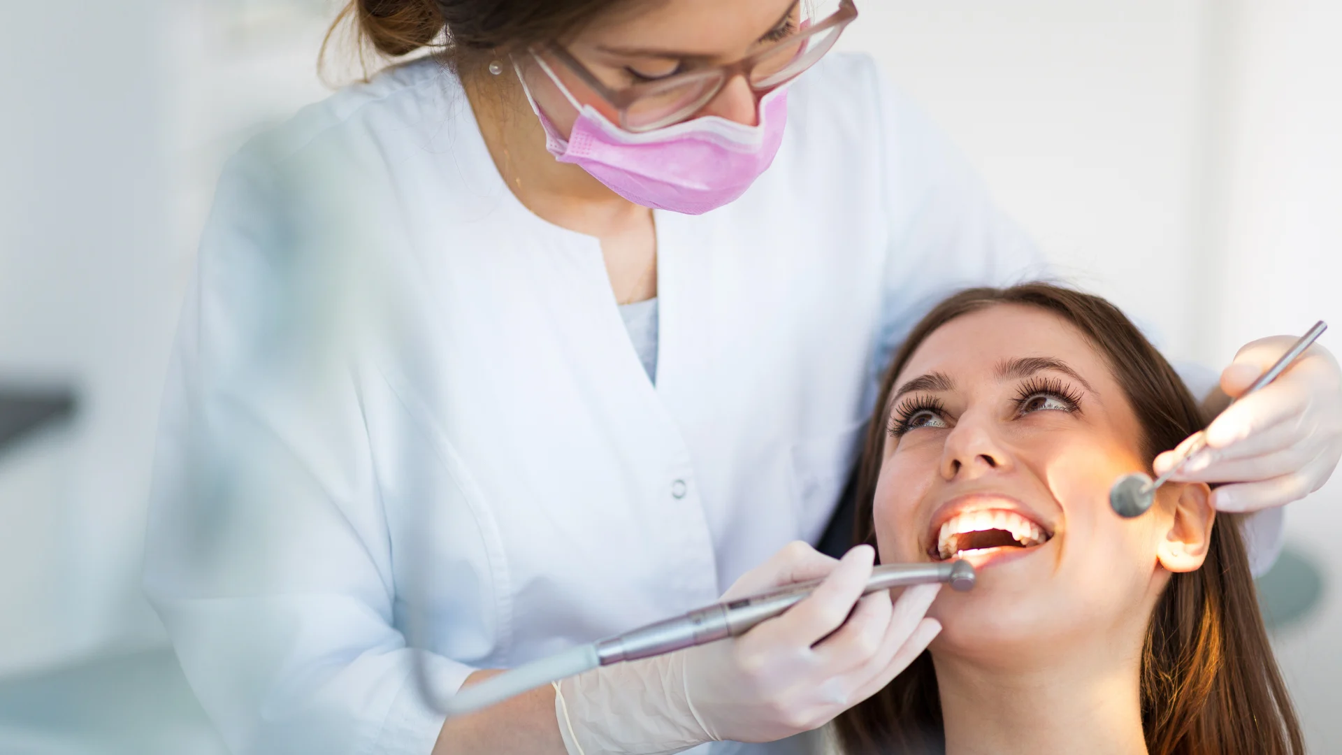 Dentist working with a female patient